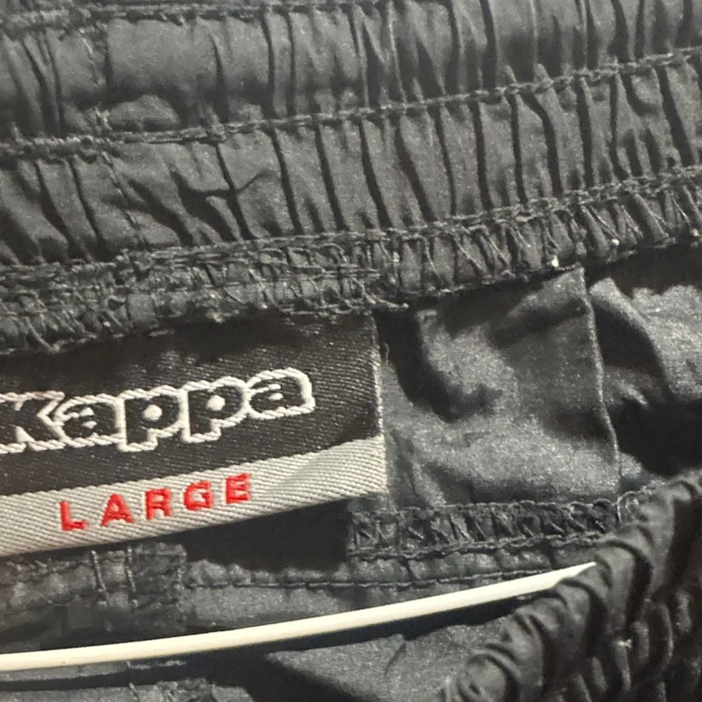 Kappa boys Black Joggers with Orange Logo